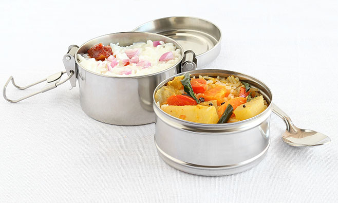 Healthy south Indian vegetarian lunch in two boxes of a lunchbox