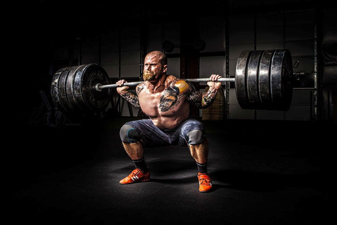 strongman squatting ATG