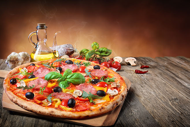 Hot Pizza Served On Old Table