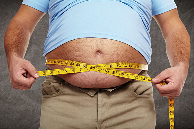 Fat belly. Man with overweight abdomen. Weight loss concept.