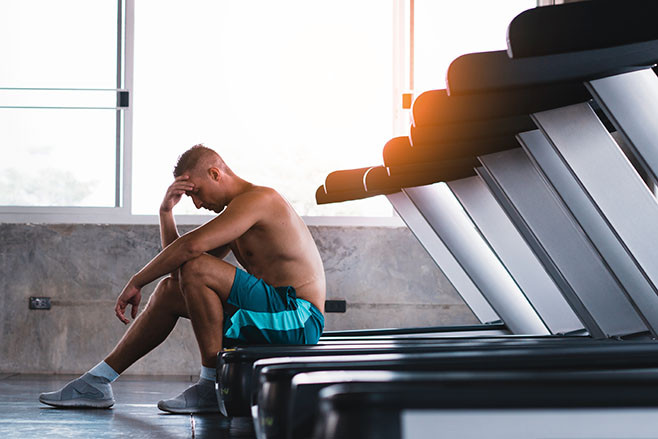 Upset man in the fitness after bad running results