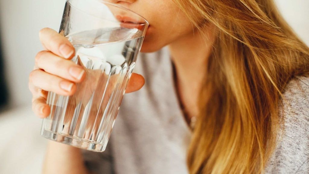 Woman drinking glass of water