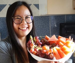 valentina holding heart shaped fruit bowl with grapes and watermelon