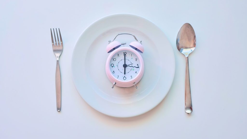 eat according to your hunger. don't let the clock dictate when you eat